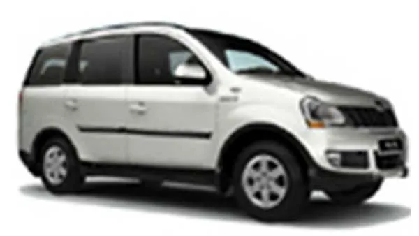 White Mahindra XUV500 SUV parked on a light gray surface
