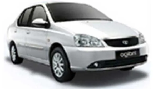 Silver Tata Indigo eCS sedan parked on a white background