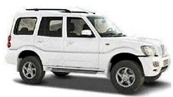 White Mahindra Scorpio SUV parked on a white background